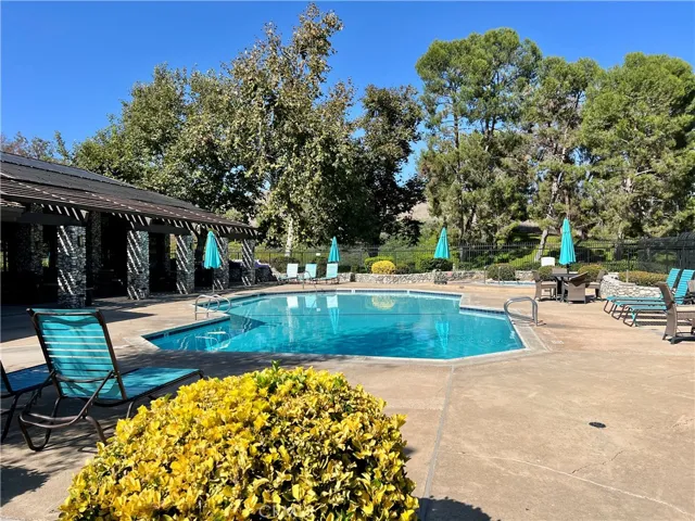 Community Center pool surrounded by beautiful trees.