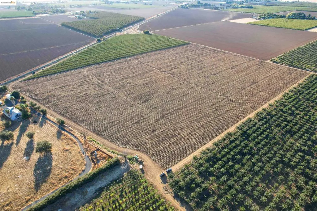 Aerial view of sparsely populated area with farmland