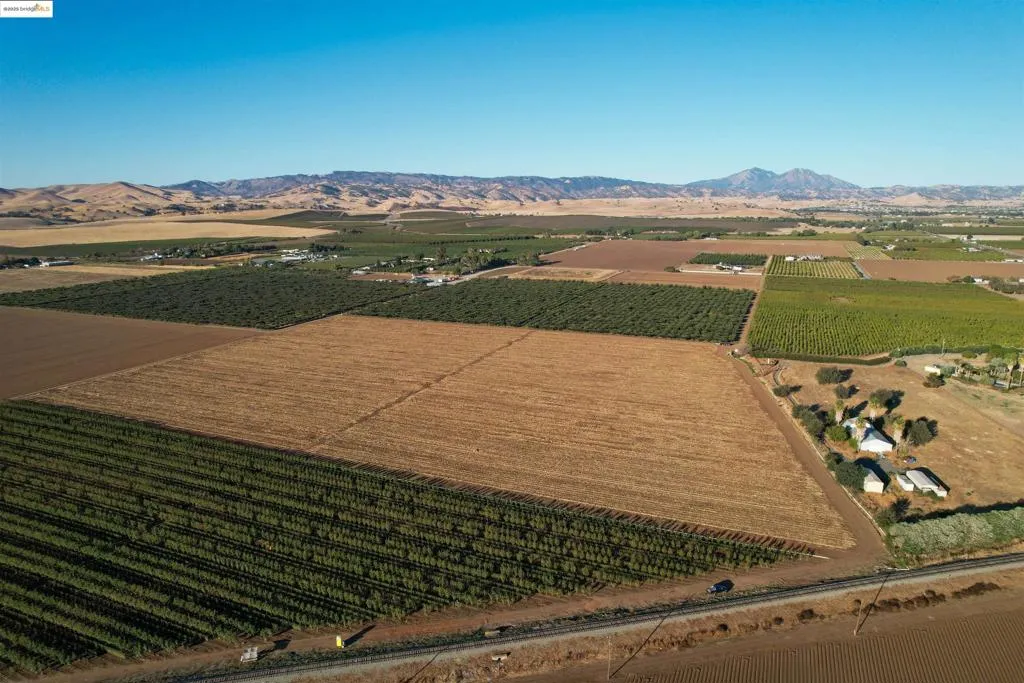 View of rural area with mountains and farmland