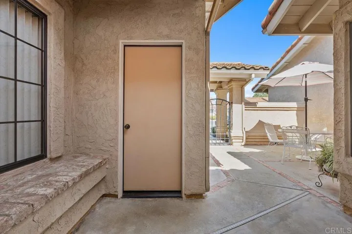 garage door leading to courtyard
