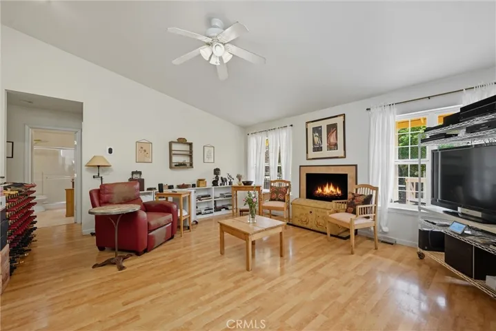 Glowing wood flooring, propane fireplace for cozy ambiance