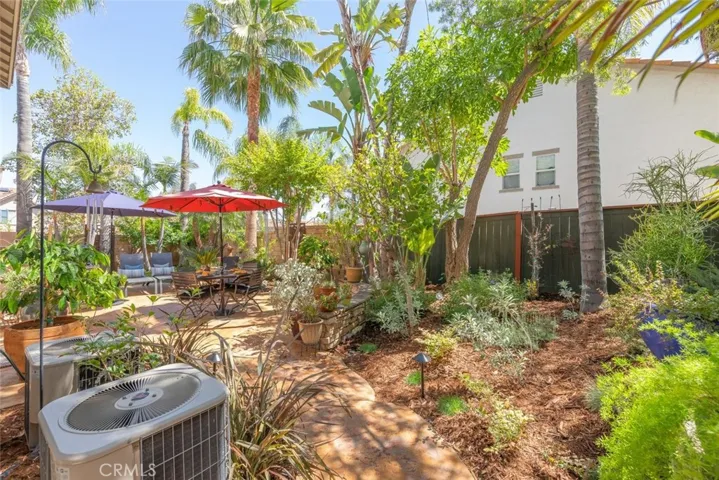 Shaded comfort, a built-in BBQ area, and ultimate backyard privacy
