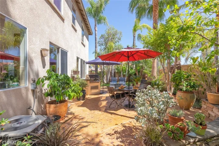 Beautiful stone patio with low-maintenance landscaping