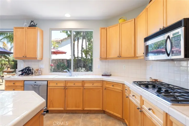 Open-concept kitchen with direct access to the outdoor patio and family room