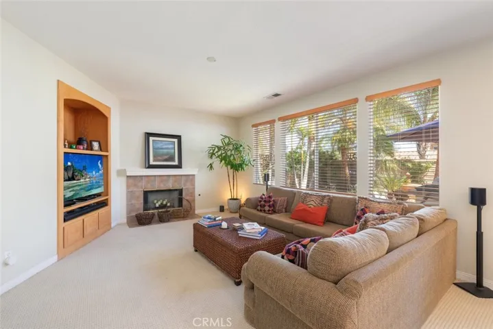 Family room with custom built-in and fireplace