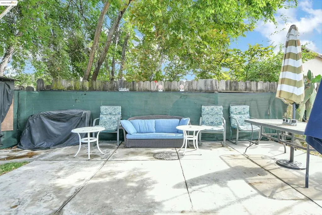 Fenced backyard with a patio area and area for grilling