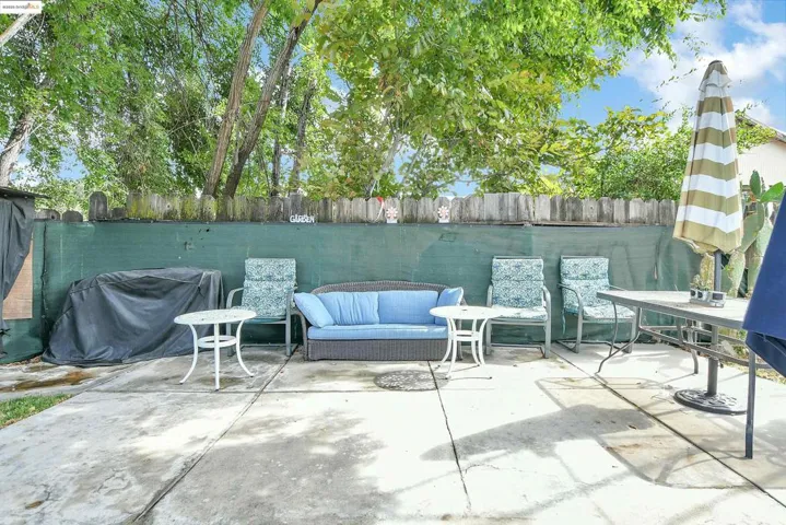 Fenced backyard with a patio area and area for grilling