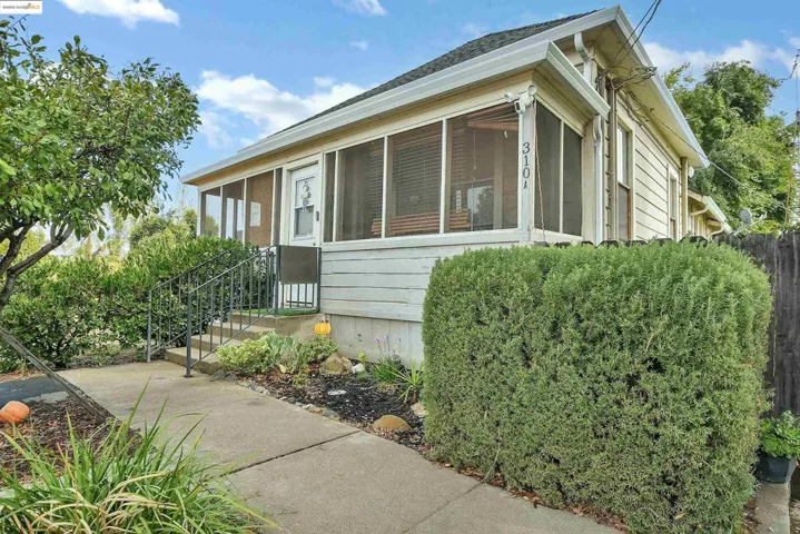 View of home's exterior featuring a sunroom