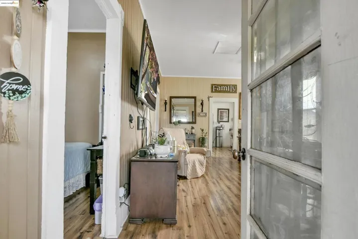 Foyer entrance with light wood-style flooring