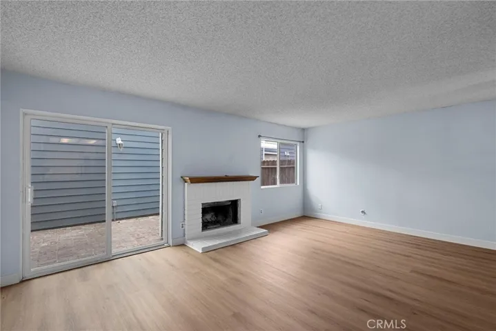 Living Room Sliding Glass door, Fireplace and Window photo taken from Kitchen Sink area