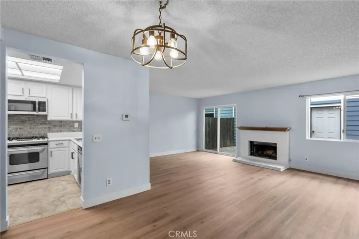 Kitchen, Living Room, Fireplace and sliding glass door from Dining Area