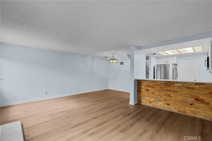 Living room Dining Area and Kitchen in view from Sliding Glass door
