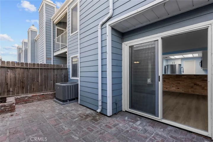 Patio area between townhouse and garage buildings