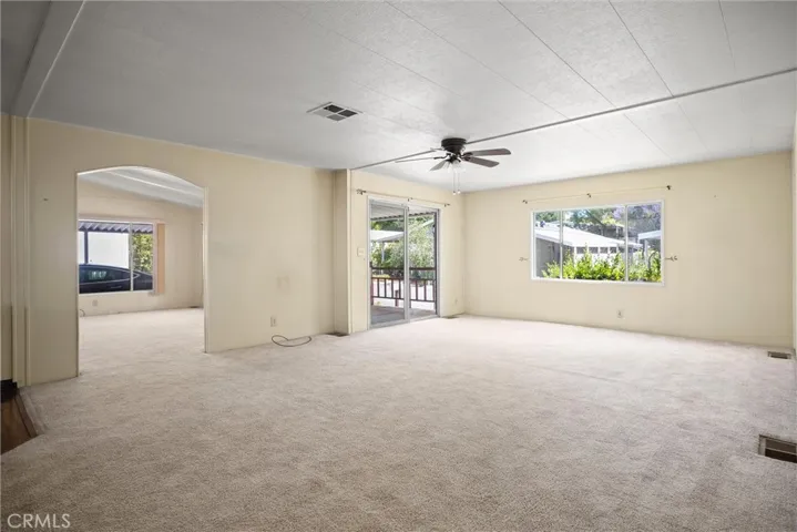 Family room arch opens to living room and dining space