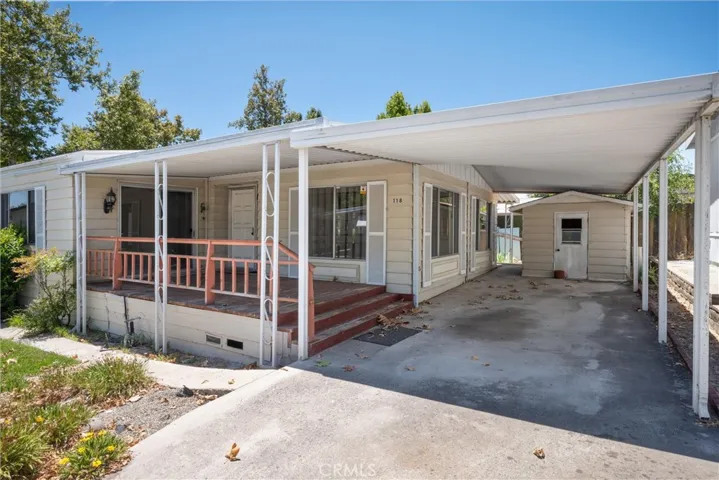 Front porch and carport/shed