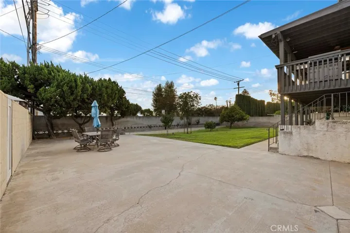 Block wall fencing encloses this lovely large, useable flat yard.