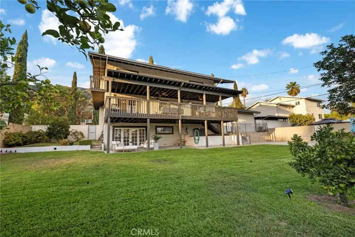 Large backyard and view of this large home.