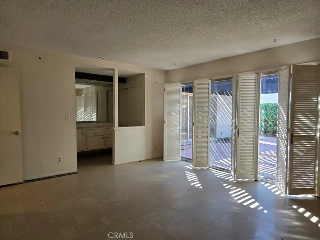 Primary bedroom with large slider leading to backyard