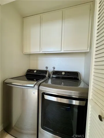 Laundry closet upstairs with brand new washer and dryer