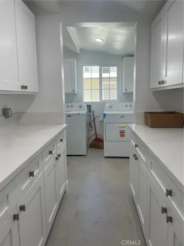 Renovated large laundry room and storage