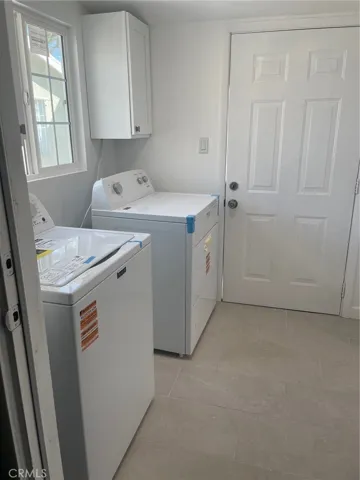 Renovated large laundry room and storage