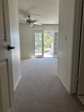 Main primary bedroom with deck. Beautiful view of trees and park-like setting.