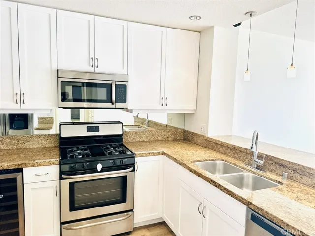 Kitchen and living area flow, creating an open and inviting layout.