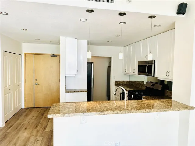 Detailed view of kitchen work area with stainless steel dishwasher.
