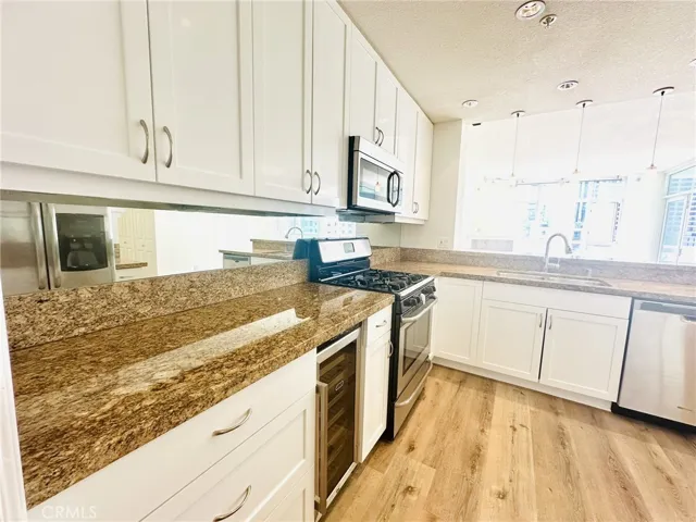 Spacious kitchen featuring generous cabinetry and modern appliances