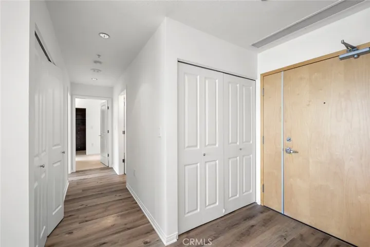 Entry hallway with wood flooring