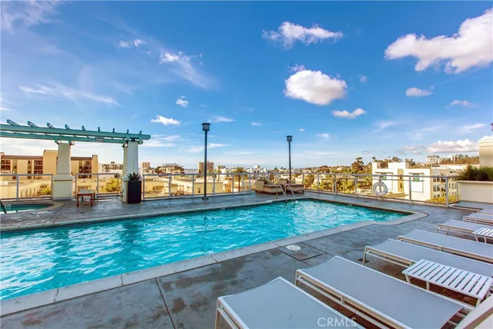 Pool deck with city skyline backdrop