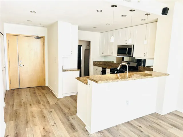 Bright living space seamlessly connected to the kitchen and dining area.