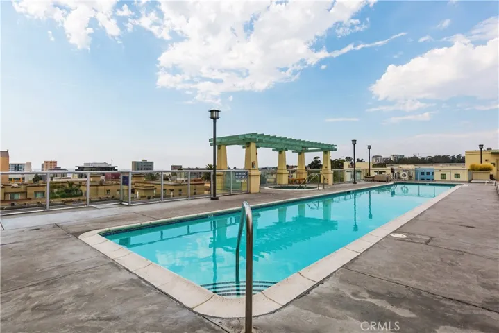 Resort-style pool with cabanas and sun deck