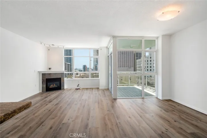 Living room with fireplace and large windows