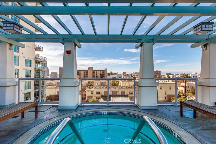 Covered lounge area beside rooftop pool