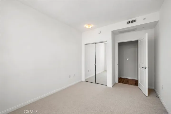Secondery Bedroom with mirrored closet doors