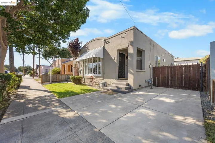 View of front facade featuring crawl space and stucco siding