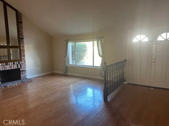 Formal Entry, Living Room with Laminate Wood like Flooring