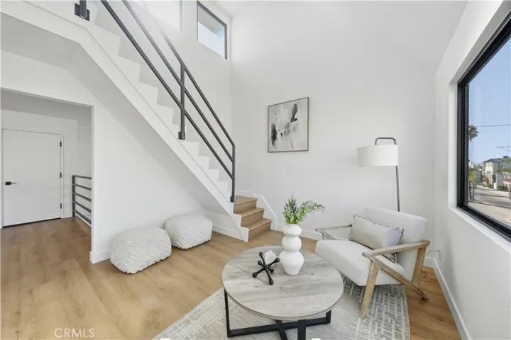 Cozy conversation room off primary bedroom with access to the 4th floor rooftop deck