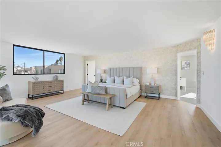 Primary retreat with designer wallpaper accent wall