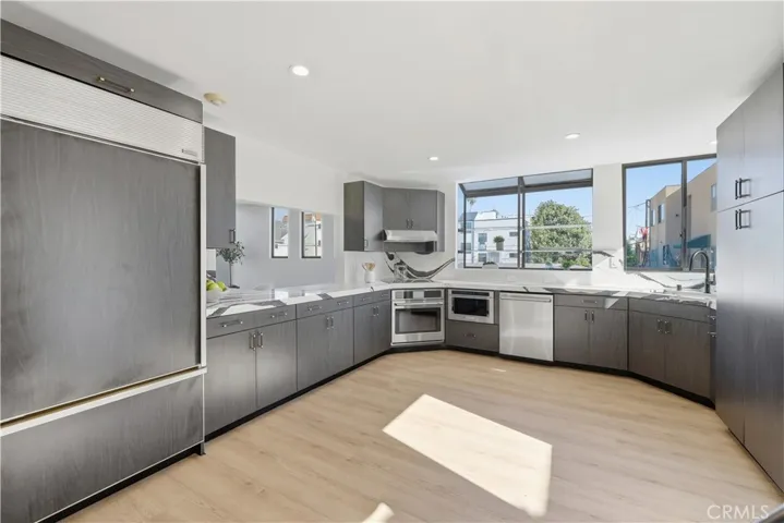 Gourmet kitchen with a suite of all new Cafe appliances and a Sub Zero refrigerator