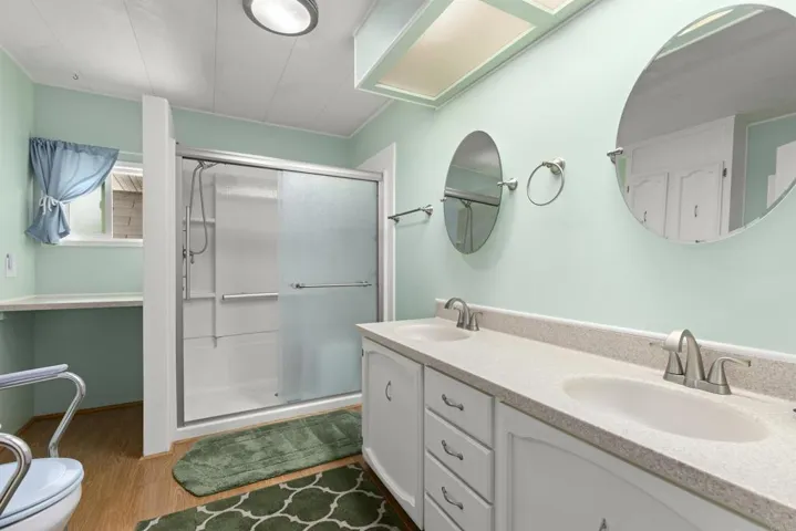 Dual sinks plus huge walk in shower and tons of storage!