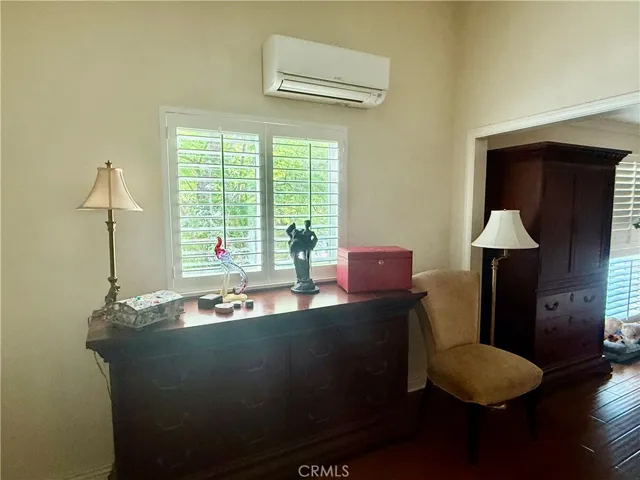 The loft area with window to lovely tree view, with the ductless air conditioning/heater
