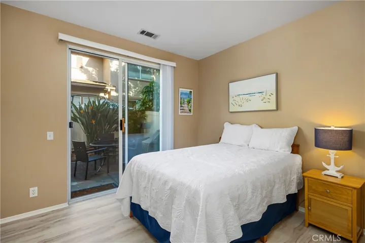 Downstairs bedroom without a closet, could be used as an office.  The sliding door leads out to the patio.