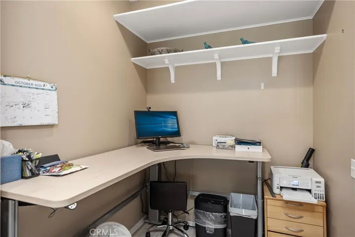 Large area at the back of the kitchen, currently being used as an office.