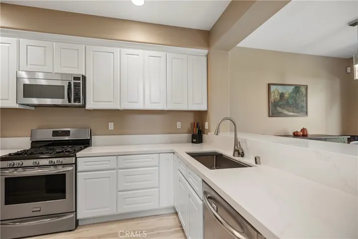Updated kitchen with quartz counters.