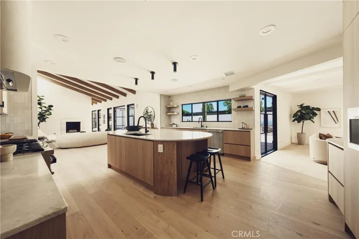 Kitchen with the view of the family room on the right and on the left formal living room #1