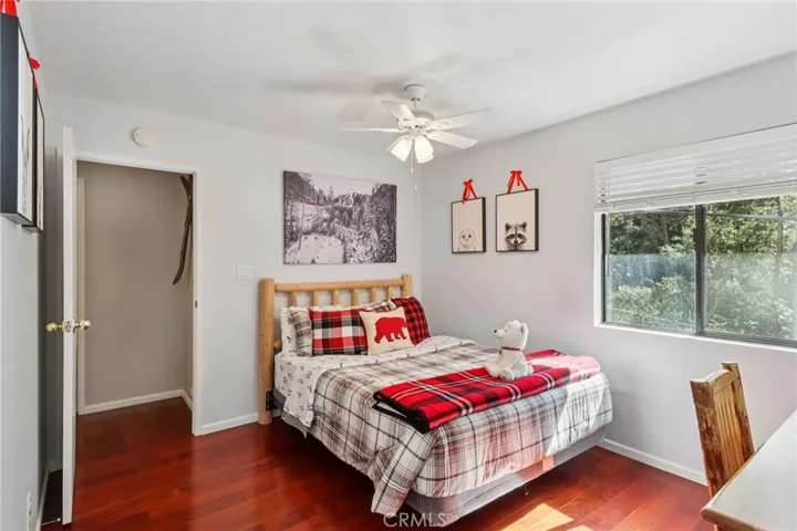 Alternate view shows room for a desk and wooded outlooks.