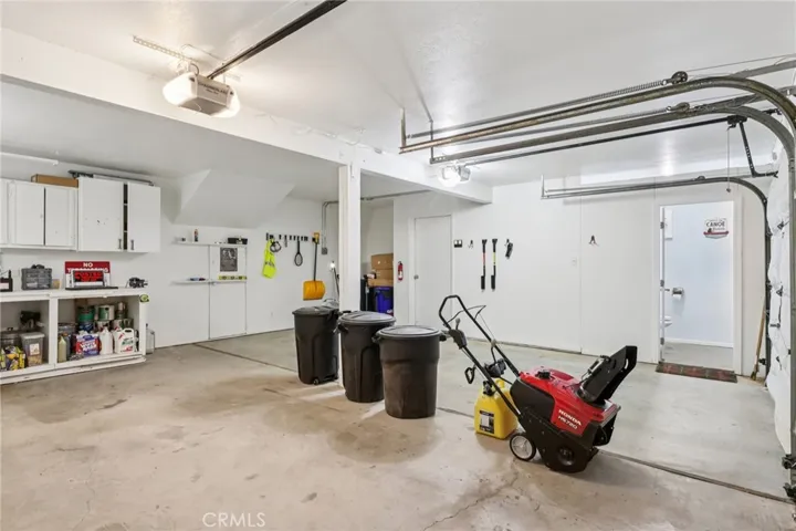 Garage reverse angle with direct access to half bath.