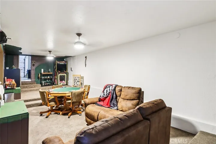 Bonus level lounging and game area with step-up zones and exterior access.